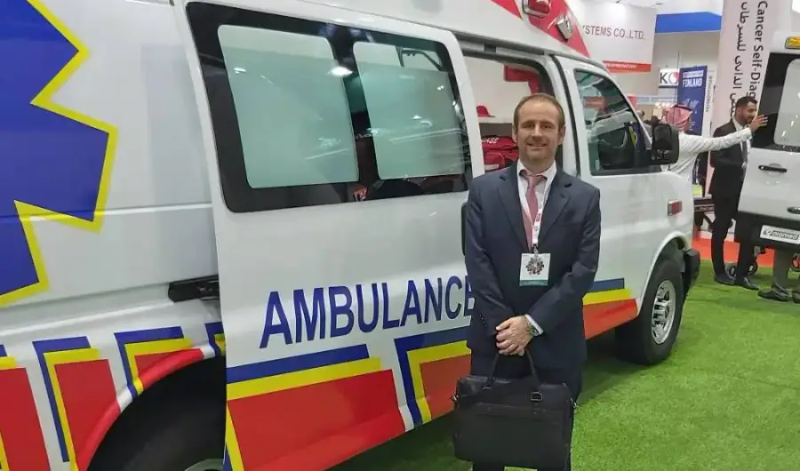 ALS team member beside an ambulance display at the Arab Health 2021 exhibition, Dubai World Trade Centre